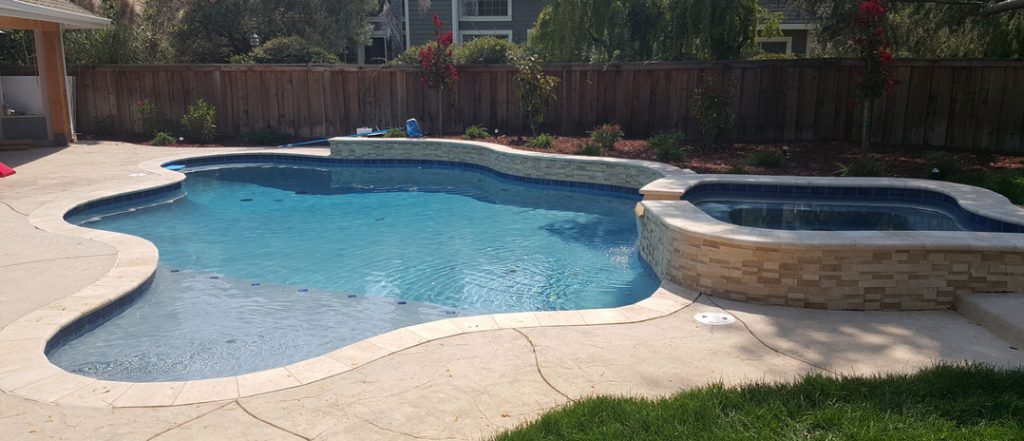 Swimming pool and hot tub designed and built by Aqua Dream pools - The Bay area pool builder.
