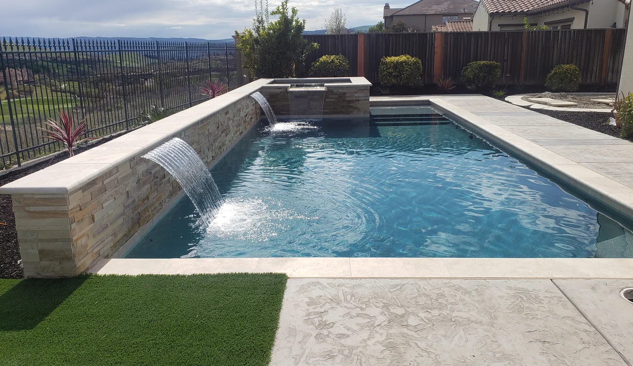 Custom pool and landscaping by Aqua dream pools