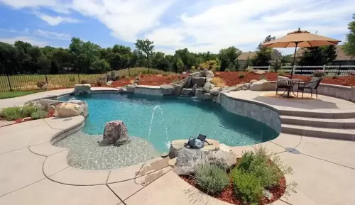 Full backyard construction project with pool and hot tub.